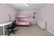 Comfortable bedroom with pink walls, carpet, a bunk bed, desk, and artwork at 1569 Shannon Falls Dr, Fort Mill, SC 29715