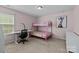 Cozy bedroom with pink walls, carpet, a bunk bed, desk, and artwork at 1569 Shannon Falls Dr, Fort Mill, SC 29715