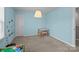 Blue bedroom with a door and small table and chairs at 1569 Shannon Falls Dr, Fort Mill, SC 29715
