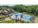 Expansive community pool with a clubhouse, lounging areas, and sun umbrellas at 1569 Shannon Falls Dr, Fort Mill, SC 29715