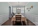 Inviting dining room with a large table, hardwood floors, and ample natural light at 1569 Shannon Falls Dr, Fort Mill, SC 29715