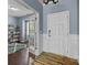 Inviting foyer with hardwood floors, white wainscoting, and an open view to a study/office space at 1569 Shannon Falls Dr, Fort Mill, SC 29715