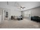 View of the living room featuring neutral walls, carpeted floors, and a ceiling fan at 1569 Shannon Falls Dr, Fort Mill, SC 29715