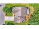 Aerial view of a home with a spacious deck, well-maintained lawn, and a driveway leading to the street at 15811 Burlingame Dr, Huntersville, NC 28078