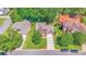 Aerial view of beautiful home with manicured lawn, mature trees, and a well-maintained neighborhood at 15811 Burlingame Dr, Huntersville, NC 28078