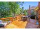 Spacious wooden back deck with outdoor seating and a grill, ideal for entertaining at 15811 Burlingame Dr, Huntersville, NC 28078