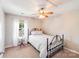 Bedroom with metal bed frame and white bedding at 15811 Burlingame Dr, Huntersville, NC 28078