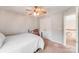 Bedroom with metal bed frame, white bedding and natural lighting at 15811 Burlingame Dr, Huntersville, NC 28078