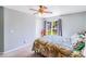 Bedroom with patterned bedspread and a large window with backyard view at 15811 Burlingame Dr, Huntersville, NC 28078