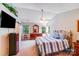 Comfortable bedroom with a ceiling fan, a bed, and a mirror above a dresser at 15811 Burlingame Dr, Huntersville, NC 28078