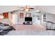 Large carpeted bonus room featuring a ceiling fan, built-in cabinets and a space for a home theater setup at 15811 Burlingame Dr, Huntersville, NC 28078