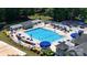 Aerial view of a community pool area featuring a large pool, seating, and covered pergolas at 15811 Burlingame Dr, Huntersville, NC 28078
