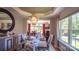Formal dining room with chandelier, table setting and bright windows at 15811 Burlingame Dr, Huntersville, NC 28078