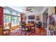 Elegant dining room with hardwood floors, large windows, and a stylish area rug at 15811 Burlingame Dr, Huntersville, NC 28078
