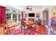 Cozy game room with a unique game table, TV, and bright windows with plush seating and ample lighting at 15811 Burlingame Dr, Huntersville, NC 28078