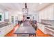 Spacious kitchen with stainless steel appliances, granite countertops, a center island with seating, and hardwood floors at 15811 Burlingame Dr, Huntersville, NC 28078