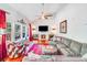 Bright living room with vaulted ceilings, fireplace, large windows, and comfortable seating area at 15811 Burlingame Dr, Huntersville, NC 28078