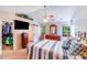 Bright main bedroom with two windows, vaulted ceilings, ceiling fan and closet, and a television at 15811 Burlingame Dr, Huntersville, NC 28078