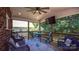Relaxing screened porch with comfortable seating and outdoor views at 15811 Burlingame Dr, Huntersville, NC 28078