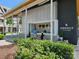 Exterior shot of a retail kiosk surrounded by lush greenery and outdoor seating in a vibrant village at 15811 Burlingame Dr, Huntersville, NC 28078