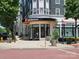 Exterior view of a Lululemon storefront with greenery, planters and outdoor lighting at 15811 Burlingame Dr, Huntersville, NC 28078