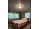 Neutral bedroom with double bed and natural light at 211 S Slack St, Albemarle, NC 28001