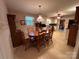 Eat-in kitchen and dining area featuring matching table and chairs, and white cabinets at 211 S Slack St, Albemarle, NC 28001