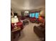 Comfortable living room with plush furniture and large windows for natural light at 211 S Slack St, Albemarle, NC 28001
