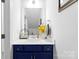 Stylish bathroom with a navy vanity, modern sink, and neutral-toned walls at 2439 Judson Dr, Gastonia, NC 28054
