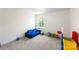 Bright bedroom featuring a cozy blue sofa, large window offering great natural light at 2439 Judson Dr, Gastonia, NC 28054