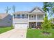 Charming two-story home featuring a welcoming front porch and well-maintained lawn at 2439 Judson Dr, Gastonia, NC 28054