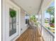 Inviting front porch featuring a cozy egg chair and classic door with sidelight and transom at 2439 Judson Dr, Gastonia, NC 28054