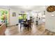 A bright open-concept kitchen/dining area featuring modern appliances and sliding glass doors to the outdoor patio at 2439 Judson Dr, Gastonia, NC 28054