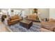 Comfortable living room with ample seating, a large rug, and an open view to the kitchen and dining areas at 2439 Judson Dr, Gastonia, NC 28054