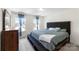 Comfortable main bedroom with a large bed, bench and soft lighting, creating a relaxing ambiance at 2439 Judson Dr, Gastonia, NC 28054