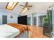 Sunlit bedroom features hardwood floors, skylights, plenty of space, and two closets at 300 S Hudson Ave, Spencer, NC 28159