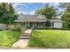 Charming home with a covered front porch, walkway and a well-manicured lawn at 300 S Hudson Ave, Spencer, NC 28159