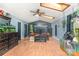 Spacious living room with skylights, dark wood accents, hardwood floors and an entertainment center at 300 S Hudson Ave, Spencer, NC 28159
