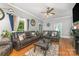 Cozy living room featuring hardwood floors and comfortable leather seating at 300 S Hudson Ave, Spencer, NC 28159