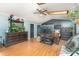Cozy living room with hardwood floors, skylight, and an entertainment center with television at 300 S Hudson Ave, Spencer, NC 28159
