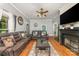 Spacious living room with hardwood floors, a fireplace and comfortable leather seating at 300 S Hudson Ave, Spencer, NC 28159