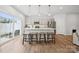 Spacious kitchen with stainless steel appliances, quartz countertops, and modern barstool seating at 3115 Hutton Gardens Ln, Charlotte, NC 28269