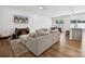 Open-concept living area with hardwood floors, neutral paint, and a view of the dining and kitchen at 3115 Hutton Gardens Ln, Charlotte, NC 28269