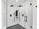 Stunning bathroom featuring a glass-enclosed shower with dual shower heads and stylish gray tile flooring at 316 Wade Hampton Dr, Matthews, NC 28104