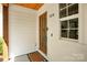 Close-up of the front door showcasing the address, a paneled glass door, and clean, white trim at 316 Wade Hampton Dr, Matthews, NC 28104
