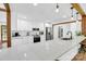 Modern kitchen with white cabinetry, a large island, stainless steel appliances, and hardwood floors for a sleek and stylish look at 316 Wade Hampton Dr, Matthews, NC 28104