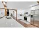 Contemporary kitchen features white cabinets, stainless steel appliances, hardwood floors, and seamless access to living areas at 316 Wade Hampton Dr, Matthews, NC 28104
