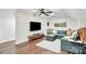 Cozy living room with plush seating, large TV, and stylish decor at 316 Wade Hampton Dr, Matthews, NC 28104
