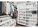 Organized walk-in closet with shelves, hanging racks, and clear storage containers at 316 Wade Hampton Dr, Matthews, NC 28104