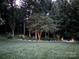 Expansive backyard landscaping with accent lighting that enhances the lush greenery and design at 322 Ethan Ln, Rock Hill, SC 29732